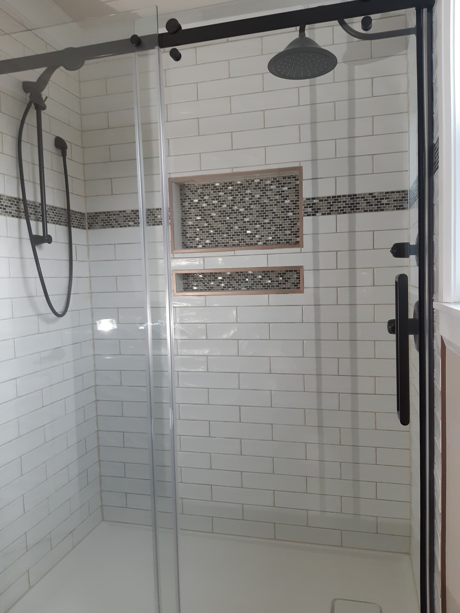 Finished bathroom renovation with walk-in shower by Tomron Construction in Maple Ridge, BC