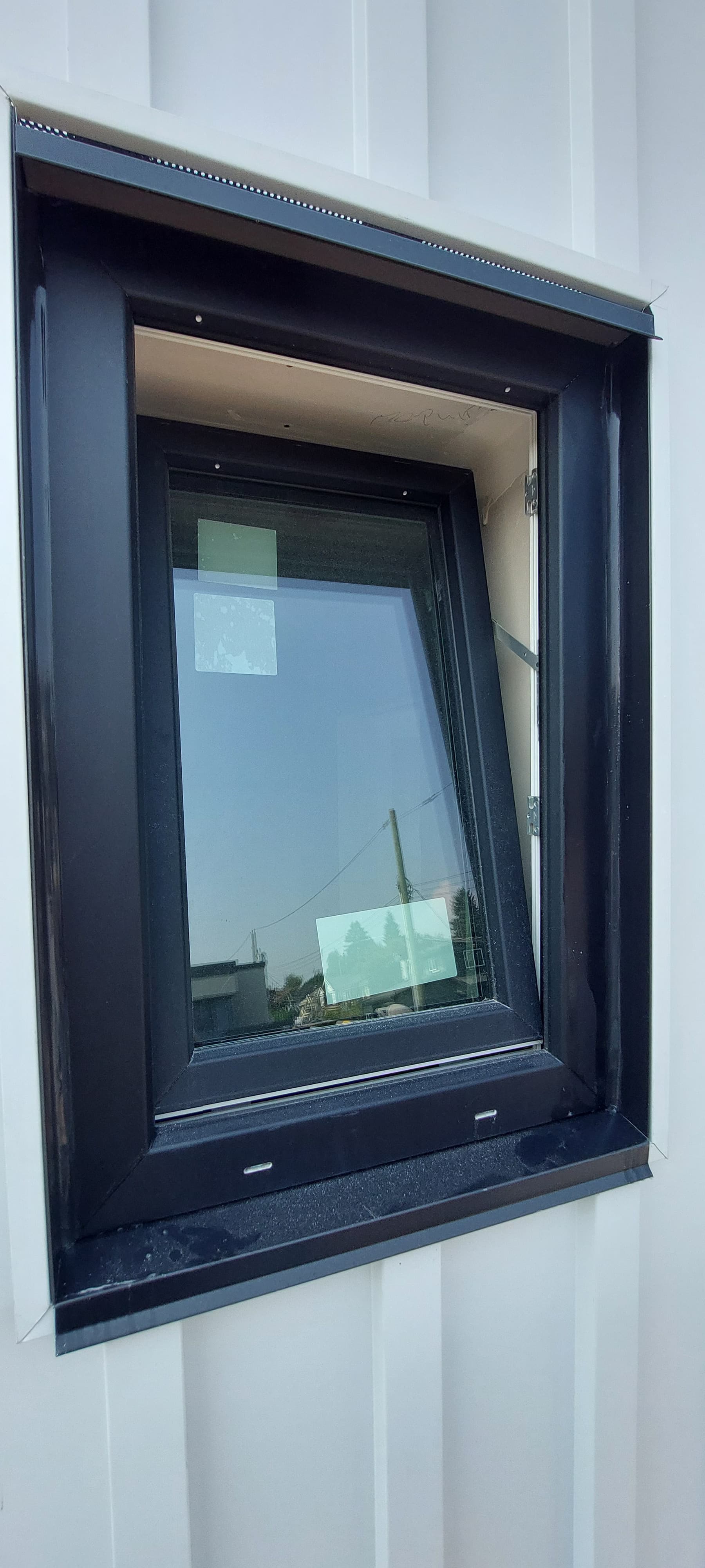 Window sill flashing with sealed end dams by Tomron Construction in Maple Ridge, BC