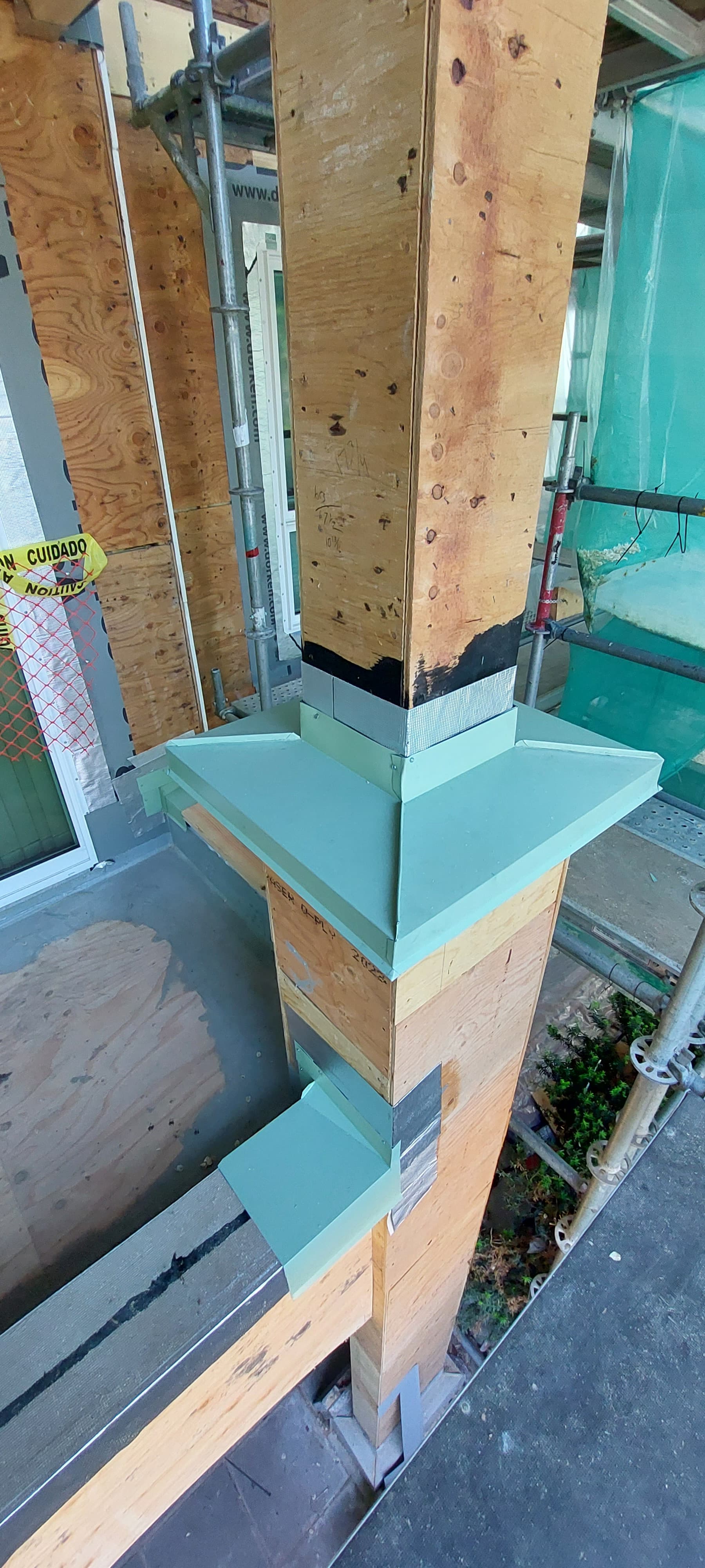 Window head flashing installation for water diversion by Tomron Construction in Maple Ridge, BC