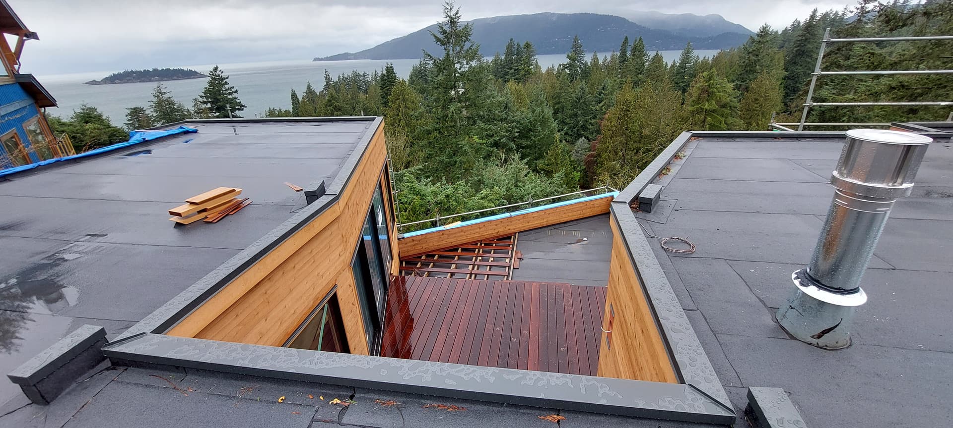 Deck-to-wall flashing connection for moisture protection by Tomron Construction in Maple Ridge, BC